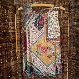 Cute Maurices tank top with fun back detail. Size S.